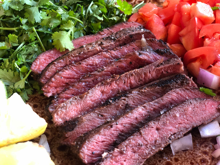 Perfectly cooked flat iron steak ready to be put in a taco or fajita